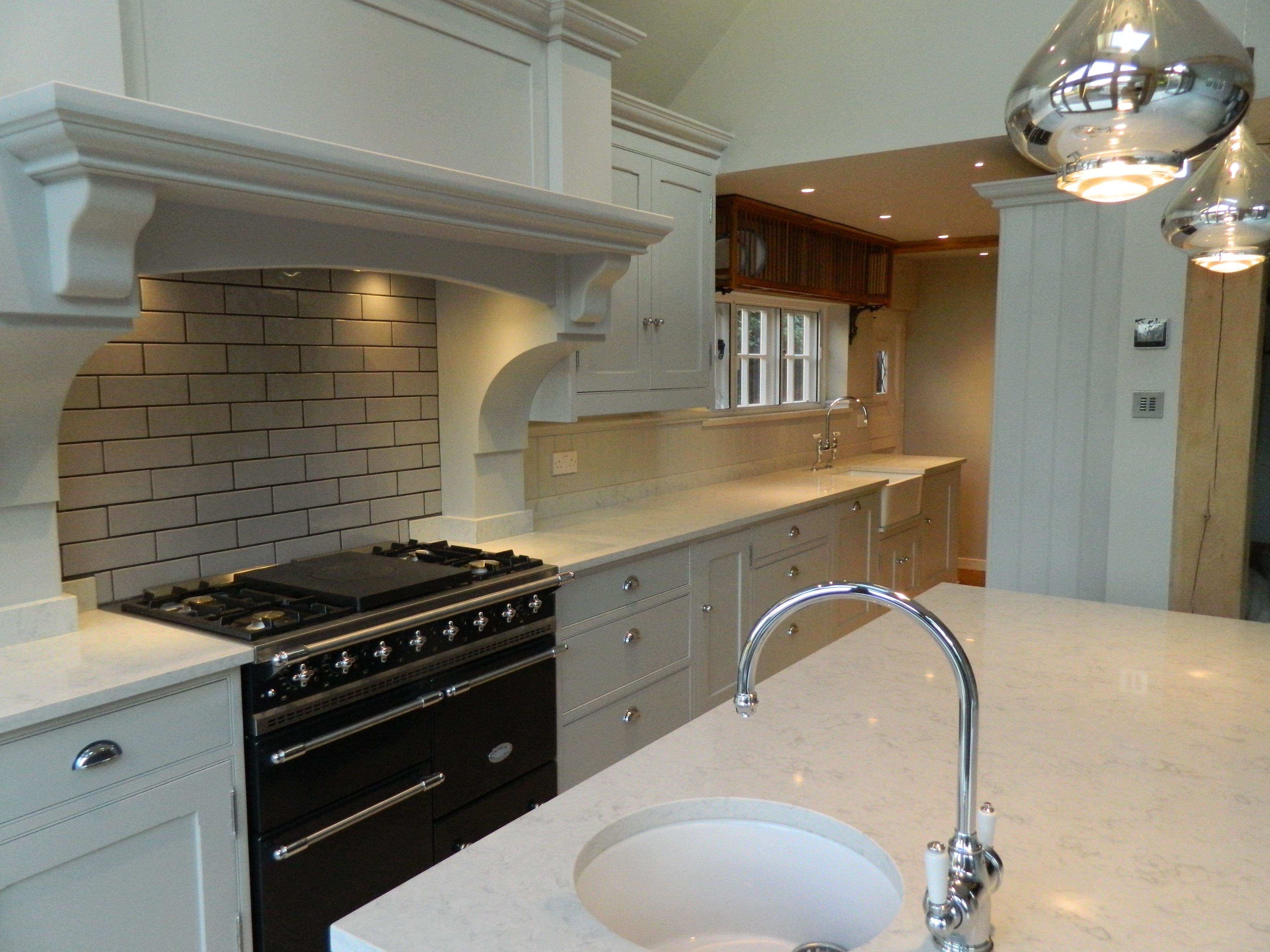 Painted bespoke kitchen with a central island